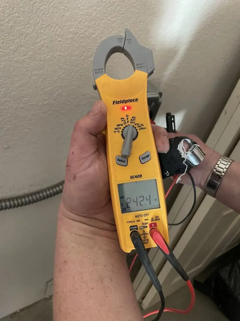 Voltage testing with clamp meter during Outlet Installation in Harbour Heights